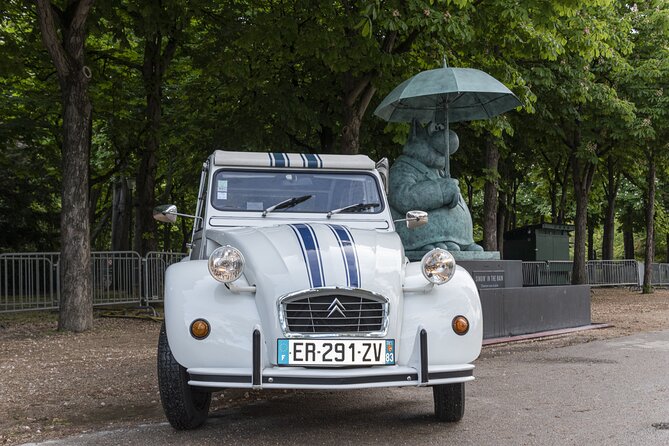 Discover Paris in a 2CV With a Glass of Champagne… 3 Passengers!