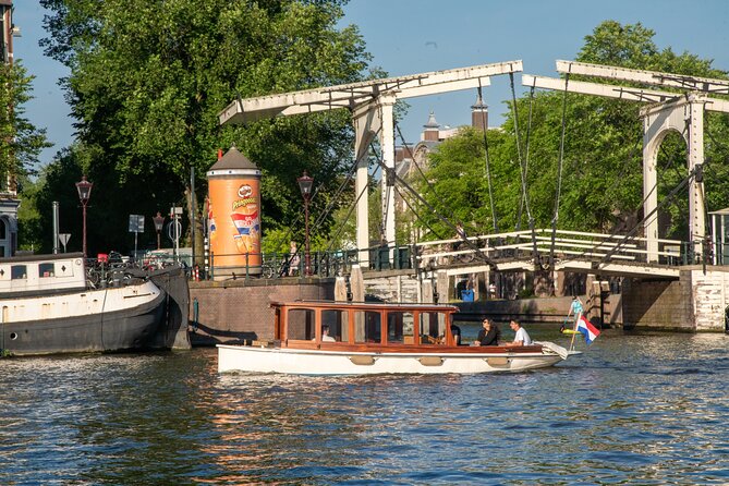 Private Boat Tour Amsterdam – 90 Min Incl. Welcome Drink on Historic Saloon Boat