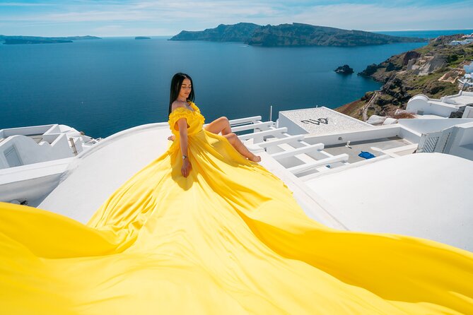 1 santorini oia private flying dress photoshoot Santorini Oia: Private Flying Dress Photoshoot