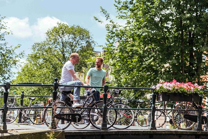 Amsterdam PRIVATE Bike Tour With Locals: Bike & Local Snack Included - Tour Highlights
