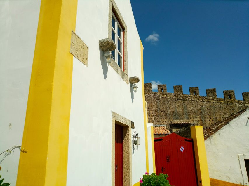 From Lisbon: Obidos and Tomar Day Trip With Transfer - Guided Experience