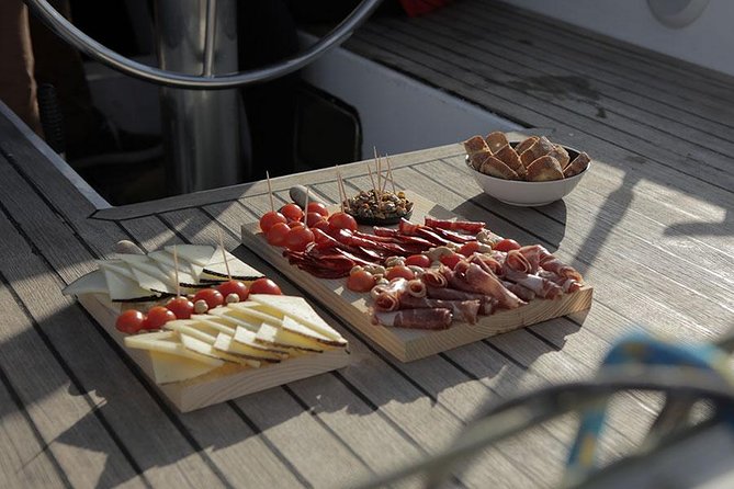 Look at Barcelona From a Sailing Boat With Tapas and Drinks - Experience Highlights