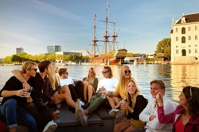 Amsterdam Canal Cruise With Live Guide and Onboard Bar - Inclusions and Onboard Services Provided