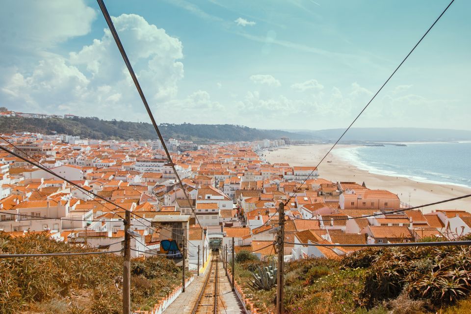 From Porto: Private Transfer to Lisbon With Stop at Nazaré - Full Experience Description