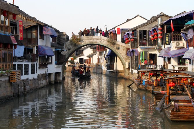 Zhujiajiao Water Town Tour Including Huangpu River Night Cruise - Tour Guide Experience and Viator Information