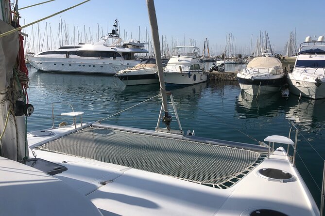 Private Full Day Catamaran Cruise From Rhodes With Food & Drinks - Pricing and Legal