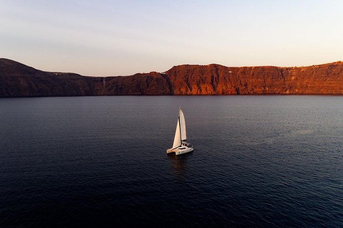 Private Luxury Caldera Cruise With a Rich BBQ Meal and Open Bar! - Booking Confirmation and Cancellation Policy