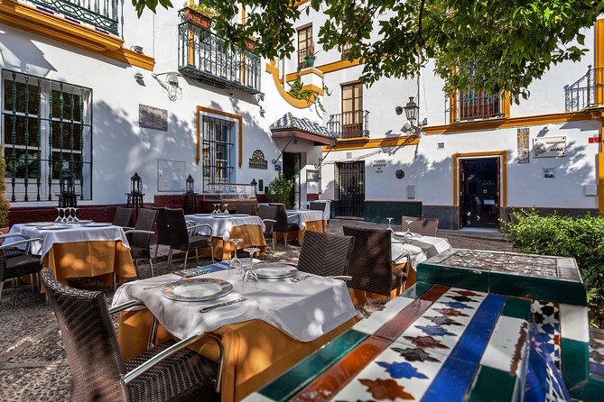 Santa Cruz Neighbourhood Guided Walking Tour in Seville - Booking and Logistics