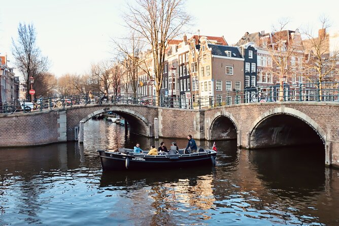 Amsterdam Canal Cruise on a Small Open Boat (Max 12 Guests) - Cancellation Policy and Weather Conditions