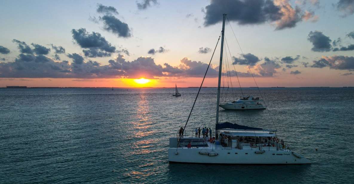 From Cancún: Isla Mujeres Sunset Catamaran Cruise - Location and Booking