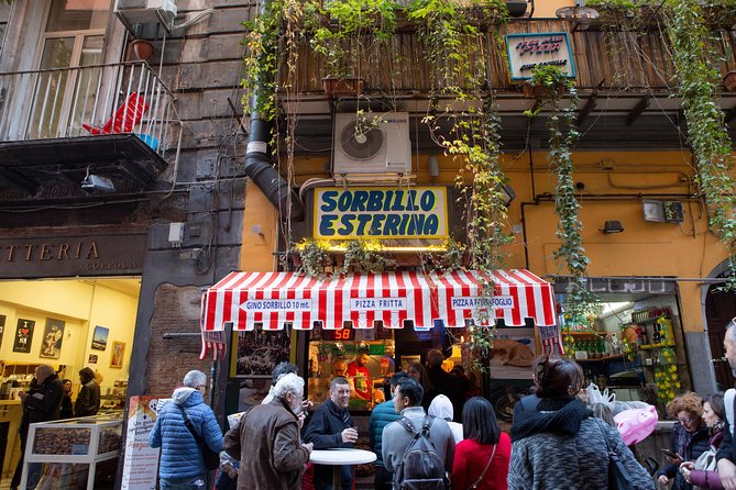 Naples Street Food Tour With Local Expert - Guides Sign and Transportation