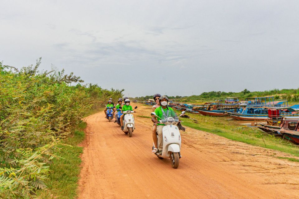 Siem Reap: Floating Village Sunset Boat Guided Vespa Tour - Location and Focus