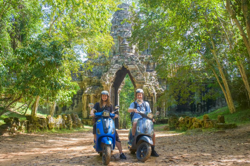 Angkor Wat: Half-Day Sunrise Vespa Tour With Lunch - Ta Prohm Temple Exploration