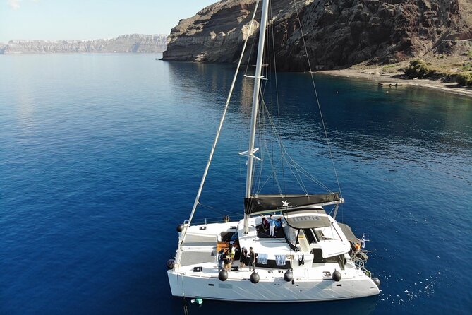 Half-Day Exclusive Catamaran Cruise in Santorini With Meal and Open Bar - Booking Details