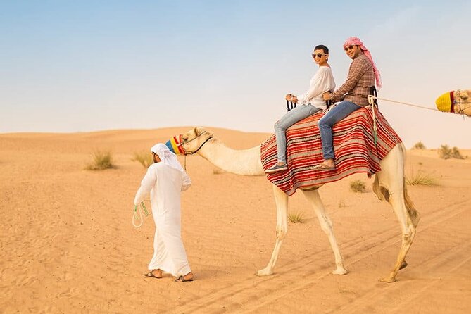 Desert Safari With Quad Bike, BBQ Dinner and Camel Ride Experience From Dubai