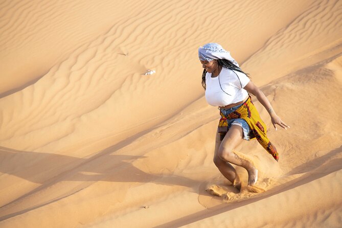 1 dubai half day red dunes bashing with sandboarding camel falcon Dubai Half-Day Red Dunes Bashing With Sandboarding, Camel &Falcon