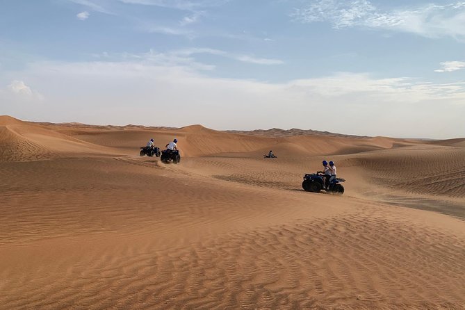 Dubai: Unique SUNSET Quad Bike Red Dunes Safari - Pickup and Drop-off Information