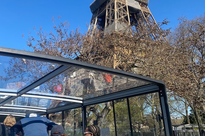 Eiffel Tower Elevator Visit With a Guide and City Bus Tour