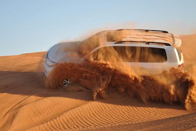 Evening Desert Safari With Camel Ride, BBQ Dinner and Dune Bashing