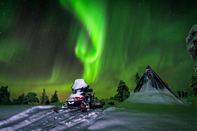 Hunting Northern Lights by Snowmobiles