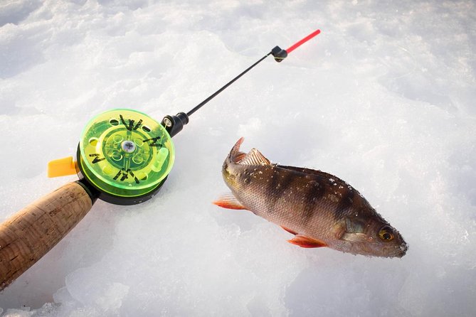 Ice Fishing On The Frozen Lake