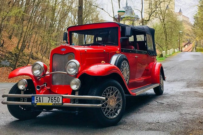 1 karlstejn castle in vintage convertible car Karlstejn Castle in Vintage Convertible Car