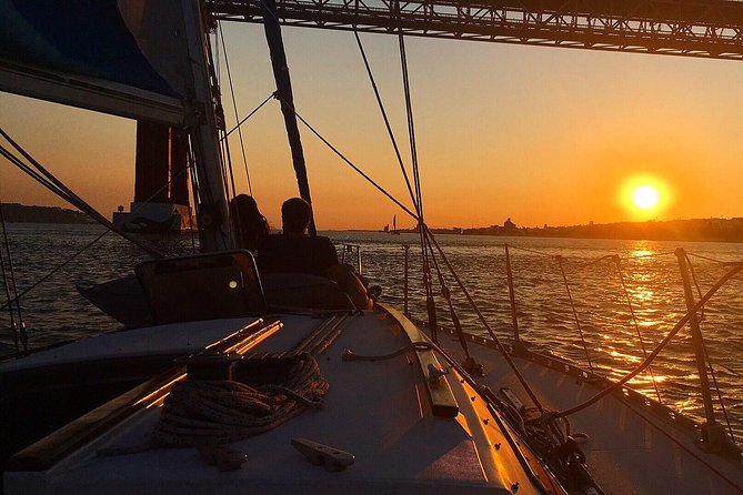 1 lisbon sunset sailing tour with white or rose wine and snacks Lisbon Sunset Sailing Tour With White or Rosé Wine and Snacks