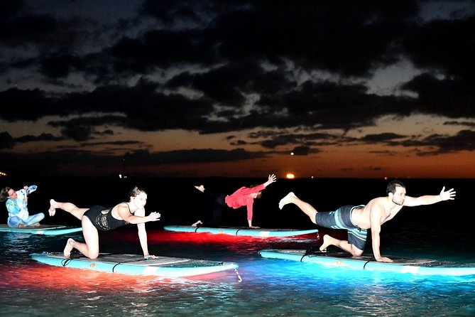 Night SUP Yoga in Honolulu, Hawaii