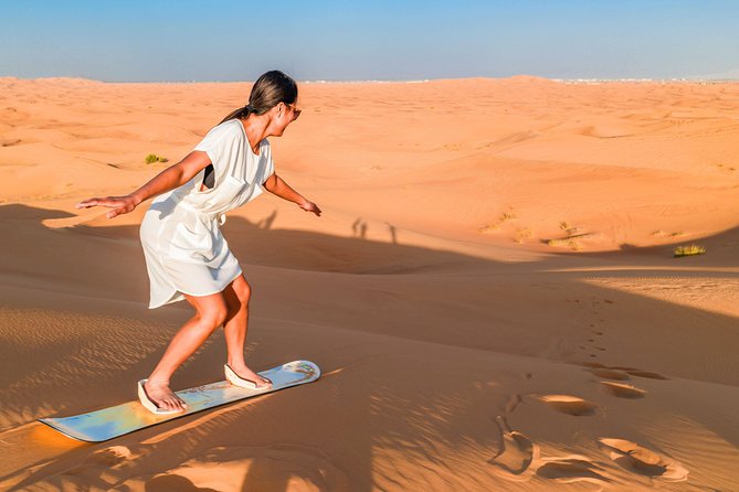 Red Dunes Desert Safari, Sand Board, Camel Ride With BBQ Dinner in Premium Camp