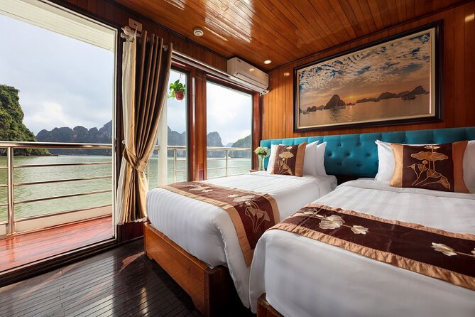 2-Day Ha Long Bay Cruise on Cozy Bay Boutique With Kayaking  - Hanoi - On-Board Activities and Dining