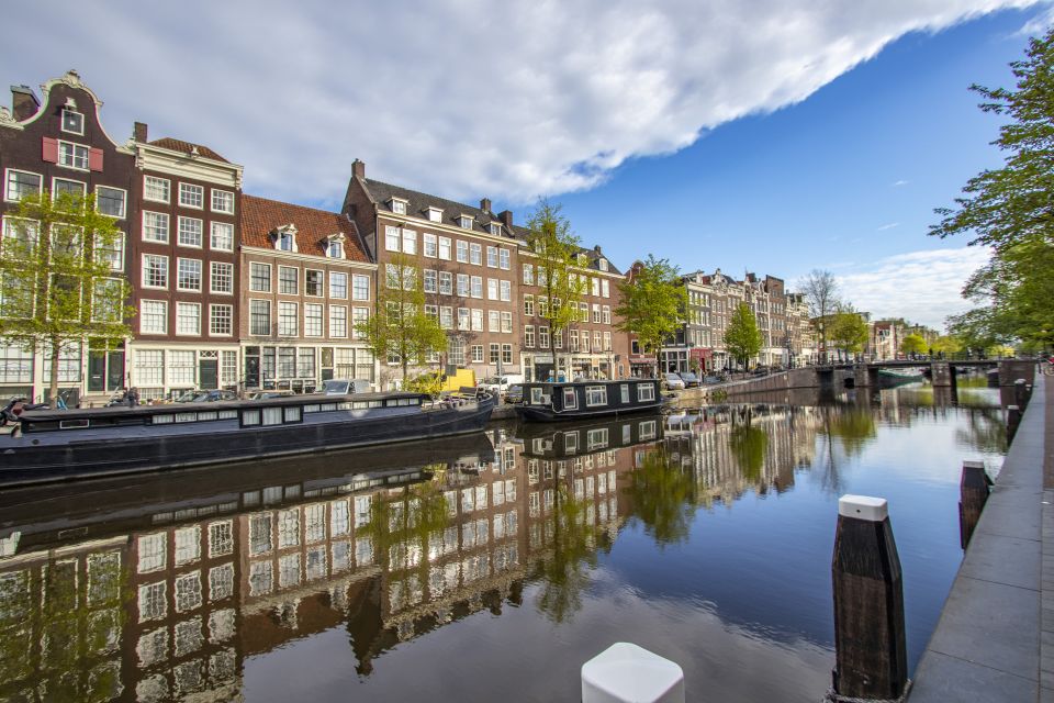 Express Walk of Amsterdam With a Local - Experience Highlights