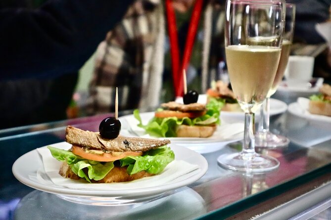 Lisbon Walking Food Tour: Tapas and Wine With Secret Food Tours - Booking and Cancellation