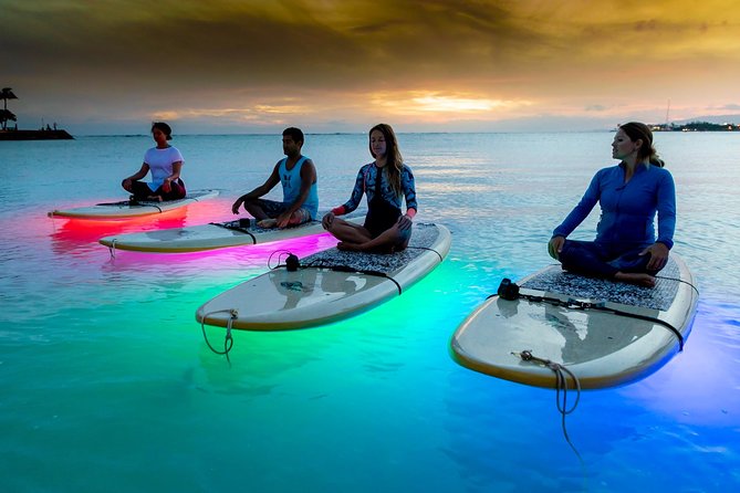 Night SUP Yoga in Honolulu, Hawaii - Sunset Yoga on Stand Up Paddleboards