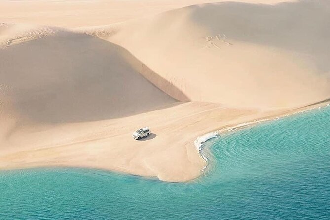 4hr Desert Safari: Sunset,Sunrise,Camel,Sand Boarding,Inland Sea - Sand Boarding Thrills in the Desert