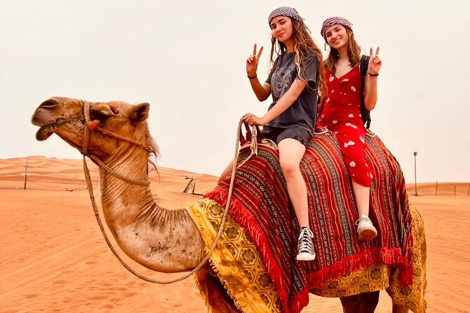 Experience Dubai Best Red Dune Safari Camel Ride Sandboarding BBQ - BBQ Delights Under the Arabian Sky