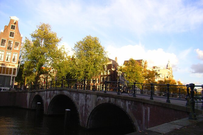 Amsterdam Private Walking Tour With A Professional Guide - Cancellation Policy and Booking Details