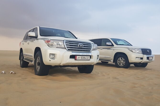 Doha: Desert Safari With Quad Bike ,Camel Ride and Sand Boarding - Explore Dohas Desert Landscape