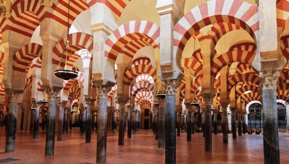 From Granada: Transfer to Seville With Cordoba Guided Tour - Discover Sevilles Rich Offerings