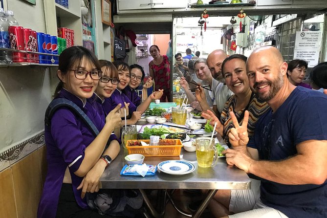Private Ho Chi Minh Street Food Tour by Motorbike With Ao Dai Female Rider - Assistance and Support
