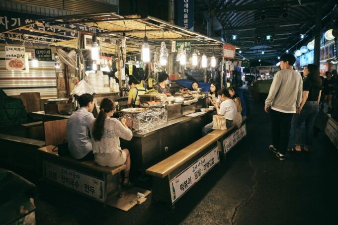 Seoul: Palace, Temple and Market Guided Foodie Tour at Night - Explore Jogyesa Temple and Night Market