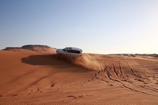 Dubai Red Dune Desert Safari: Camel Ride, Sandboarding & BBQ Options - Optional Quad Biking