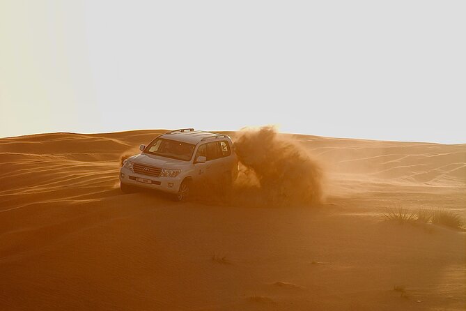 Doha Sunrise Desert Safari Tour Dune Bashing Inland Sea Visit Camel Riding - Key Points