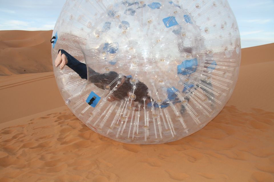 Extreme Adventure With Harness Zorbing in Merzouga Dunes - Key Points