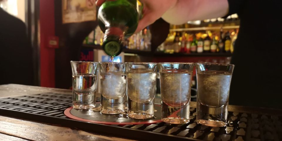 Lisbon: Pub Crawl Walking Tour With Shots and Drinking Games - Key Points