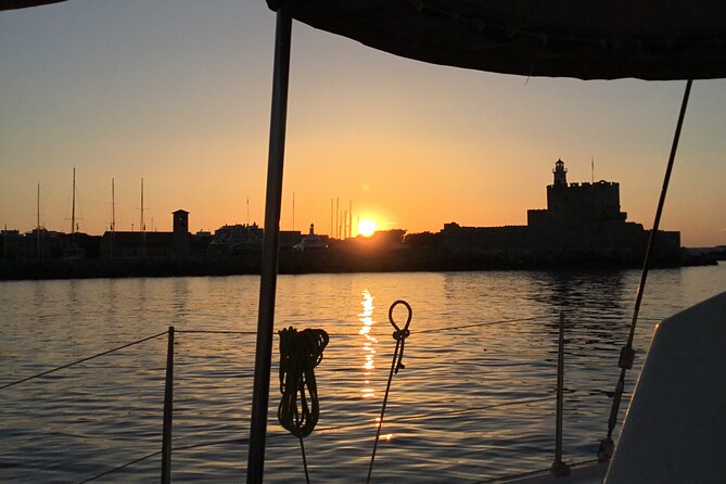 Private Sunset Catamaran Cruise From Rhodes With Dinner & Drinks - Key Points