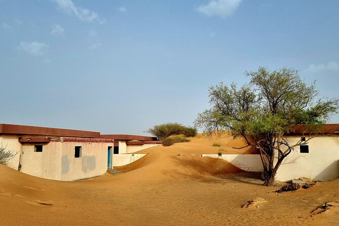 The Ghost Village Safari Tour With Dune Bashing and Sandboarding - Key Points