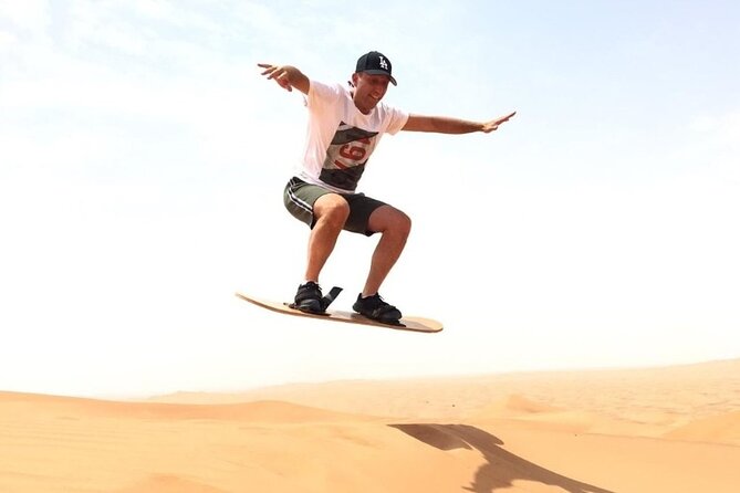 Arabian Red Dune Desert Safari With Sand Boarding & Camel Ride