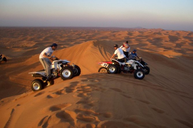 Dubai Red Dunes Safari by Quad Bike, Sand Boarding, Camel Ride & BBQ Dinner