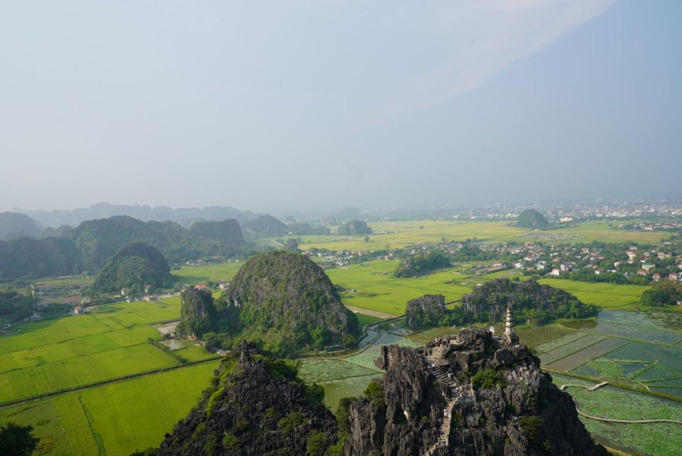 1 local farmer riding buffalo hoa lu tam coc boating tour Local Farmer Riding Buffalo - Hoa Lu - Tam Coc Boating Tour