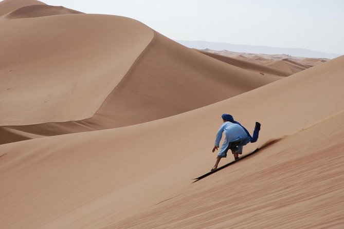 Private Desert Sandboarding Camel Riding and Dune Bashing